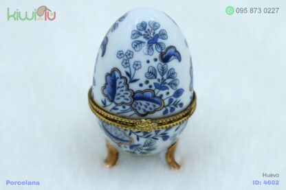 Adorno de porcelana en forma de huevo con filos dorados