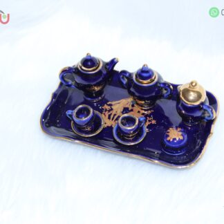 Adorno de juego de tazas de porcelana color azul con filos dorados